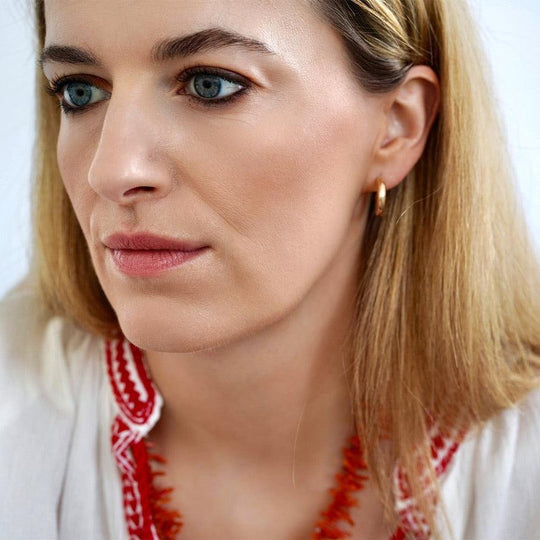 The History of Gold Hoop Earrings - Mayveda Jewelry